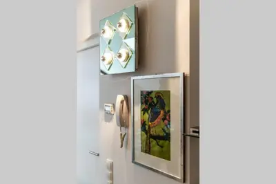 a room with a phone and paintings on the wall at Zweizimmer-Wohnung mit Schlossblick in Chiusa