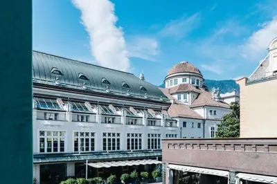 a large white building with a dome on top of it at Lorent House in Merano
