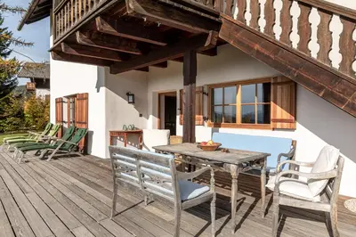 a wooden deck with a wooden table and chairs at Haus Sophie in Longomoso