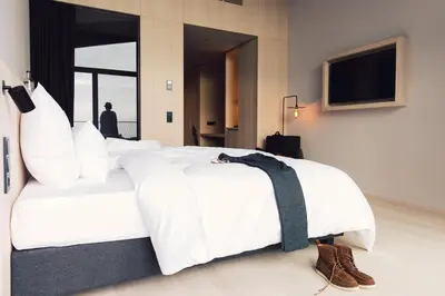a room with a view of a body of water at Hotel Milla Montis in Maranza