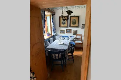 a dining room with a table and chairs at Paola’s Country Home - Vanoi Primiero Trentino in Canale San Bovo