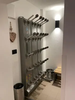 a kitchen with a rack of shoes in a room at Col Dala Vara in San Cassiano