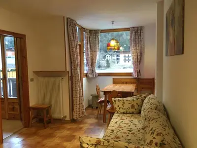 a living room with a couch and a table at Appartamento Nemo in Alleghe