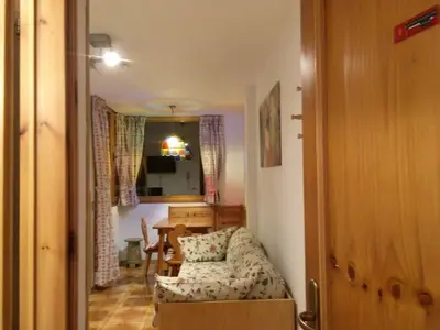 a living room with a couch and a table at Appartamento Nemo in Alleghe