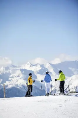 a group of three people on skis in the snow at Hotel Schölzhorn Superior in Racines