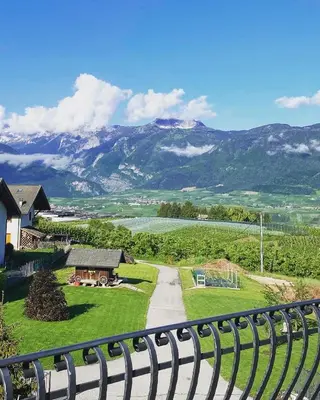 a view of a mountain from a fence at Affittacamere Dolce Sogno in Coredo