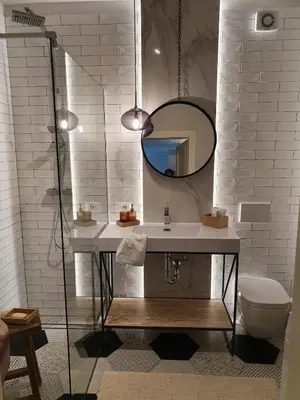 a bathroom with a sink and a mirror and a toilet at THE MIRROR GUESTHOUSE - TERME MERANO in Merano