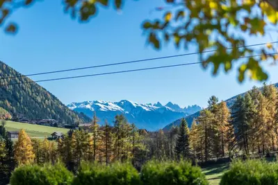 a view of the mountains from a tree at Hotel Kaserhof in Valles