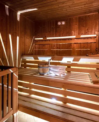 an empty sauna with a bucket in it at Hotel Kaserhof in Valles