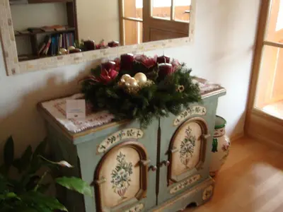 a dresser with a christmas display in a room at Winnewieser in Vandoies