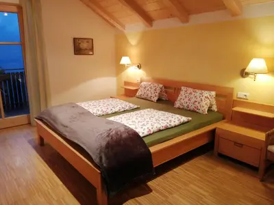 a bedroom with a bed with two pillows on it at Kerschbamerhof im Süden Südtirols in Cortaccia