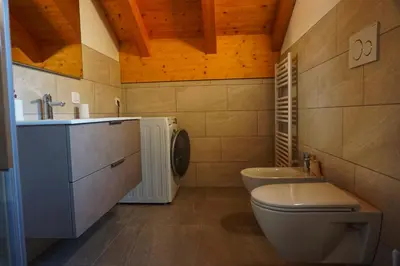 a bathroom with a toilet and a sink at Agritur Zuveith in Salorno sulla Strada del Vino