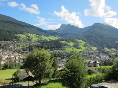 a view of a town in the mountains at Hotel Ronce in Ortisei