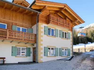 a large building with snow on the ground at Apartment Fabio Deluca by Interhome in Vigo di Fassa