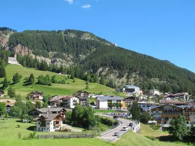 a small village in the mountains with a road at Apartment Fabio Deluca by Interhome in Vigo di Fassa