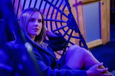 a young woman sitting in a chair at Sweet Dolomiti Sonneck in Maranza