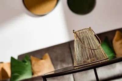 a metal lantern sitting on top of a table at Hotel Brunnhofer in Tirolo