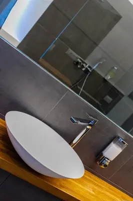 a bathroom with a white toilet and a sink at Apartment Mulino in Merano