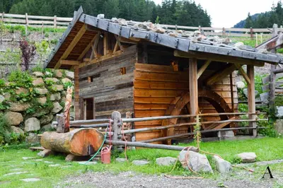 a log cabin with animals on top of it at Maurerhof in Racines