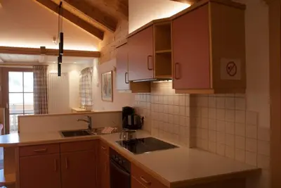 a kitchen with wooden cabinets and a counter top at Maurerhof in Racines