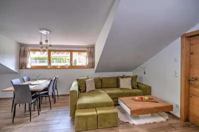 a living room with a couch and a table at Moarhof in Oberbozen in Soprabolzano