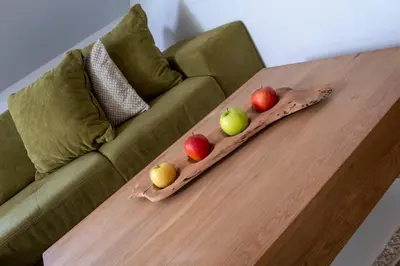 three apples on a wooden table on a couch at Moarhof in Oberbozen in Soprabolzano