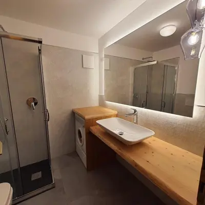 a bathroom with a sink and a mirror at Casa Maddalena in Canazei