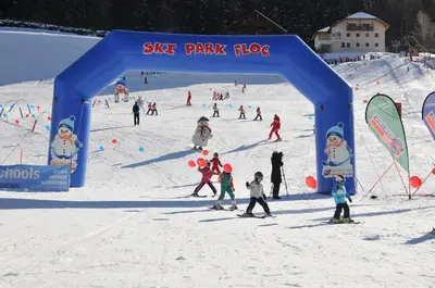 a group of people skiing on a ski slope at Apartment Cesa Collina Family Retreat in Ortisei