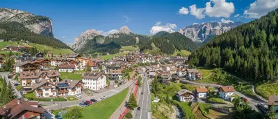 an aerial view of a town in the mountains at Apartments Rusctlea in Selva di Val Gardena