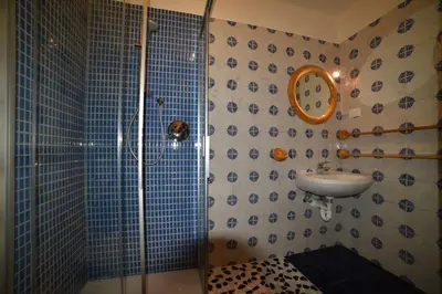 a bathroom with a shower and a sink at Il cirmolo in Vigo di Fassa