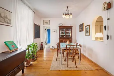 a dining room with a table and chairs at Casa Al Duomo-Nel cuore storico di Merano in Merano