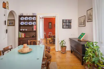 a room with a table and chairs and a dining room at Casa Al Duomo-Nel cuore storico di Merano in Merano