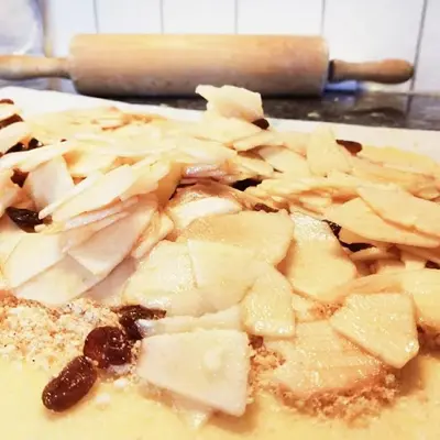 a plate of food with bananas on a table at Lüch dl Jëinder in San Martino in Badia