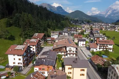 an aerial view of a village in the mountains at Condominio Le Coste in Falcade