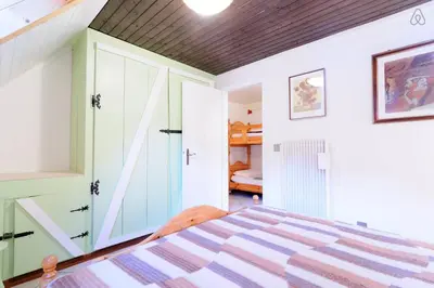 a bedroom with a bed in a room at Appartamento MARMOLADA - CANAZEI in Canazei
