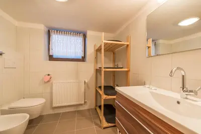 a bathroom with a sink and a toilet and a sink at Ottohof - Feldblick in Colle Isarco