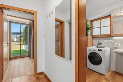 a laundry room with a washer and dryer at Apartment Panorama Val di Non in San Felice