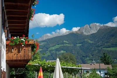 a balcony with a view of a mountain at Schlettererhof in Tirolo