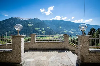 a balcony with a view of a mountain at Gasthof Bauhof in Brunico