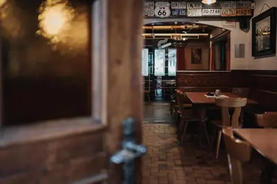 a view of a restaurant with tables and chairs at Gasthof Residence Brugghof & Erlhof in Campo Tures