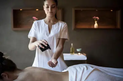 a woman giving a man a bath in a spa at Adler Spa Resort Balance in Ortisei