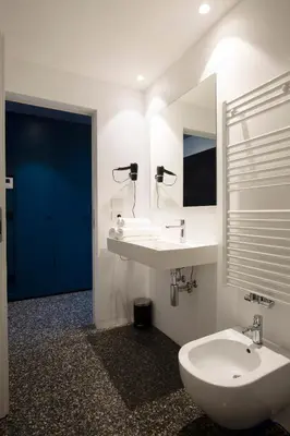 a bathroom with a sink and a mirror at Pepper Suite in Bolzano