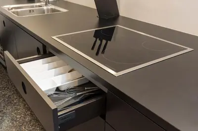 a kitchen counter with a sink and a drawer at Pepper Suite in Bolzano