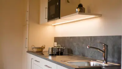 a kitchen with a sink and a counter top at Holzerhof in Valdaora di Sotto