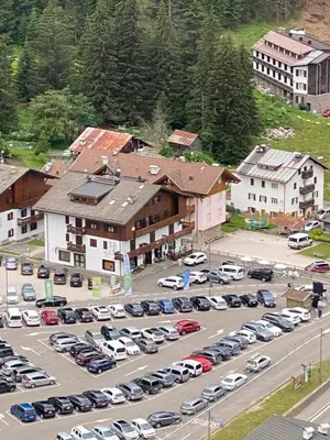 an aerial view of a parking lot with cars at Casa Doleda in Alba di Canazei