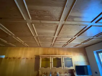 a room with a wooden ceiling and a window at Casa Doleda in Alba di Canazei