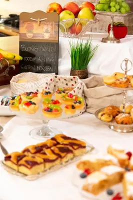 a table topped with plates of pastries and pies at Appartamento Le Colonne - Relais Villa Quercia in Tassullo