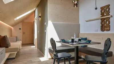 a dining room with a table and chairs at Castell Matscher in Bressanone