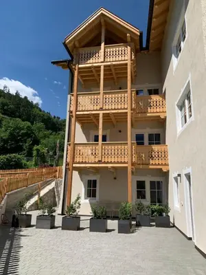 a building with a balcony on the side of it at Castell Matscher in Bressanone
