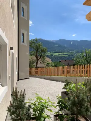 a courtyard of a house with a fence at Castell Matscher in Bressanone